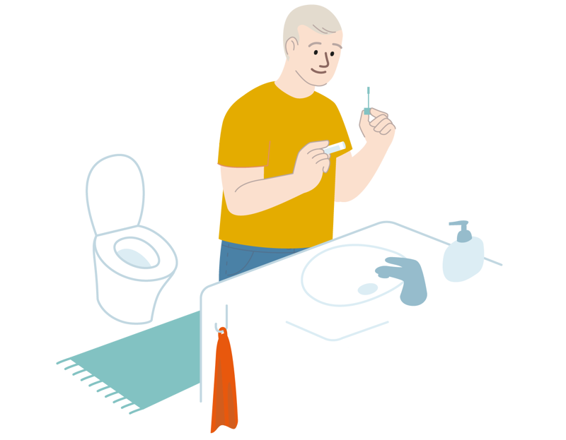 Mann står med en avføringsprøve på badet