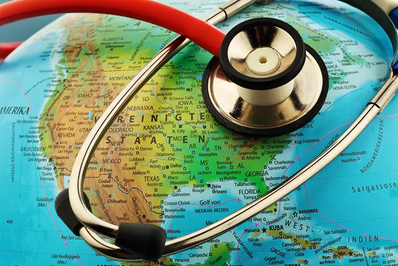 Illustrasjon av et stetoskop rundt jordkloden. Bilde.