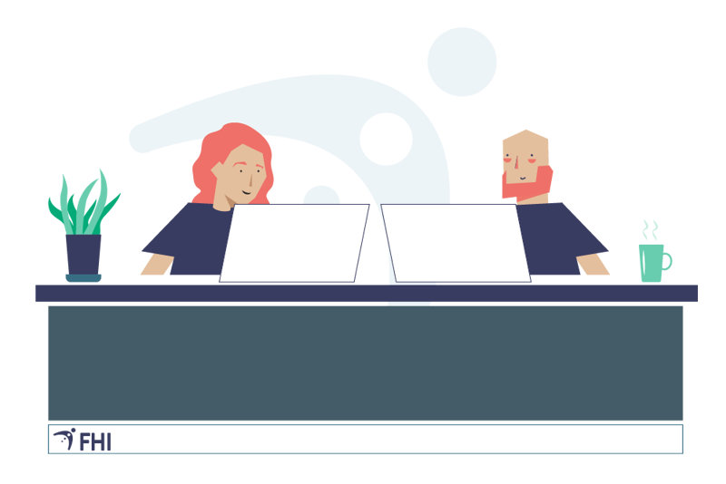 En mannlig og en kvinnelig forsker som sitter ved et stort bord med hver sin PC