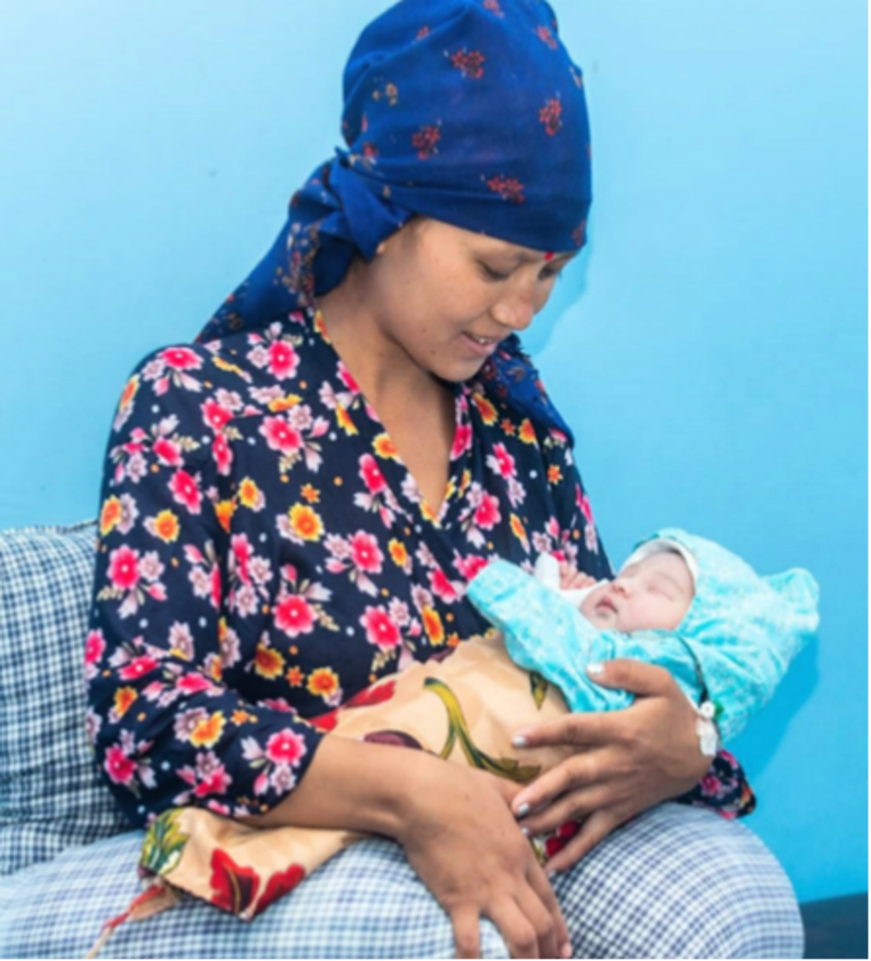 Mother with newborn child on her lap